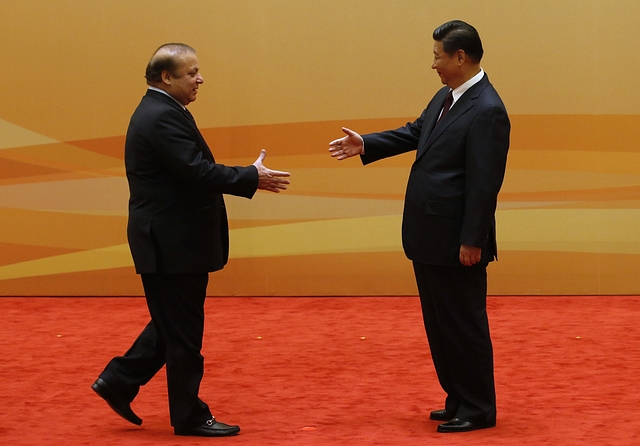 Nawaz Sharif and Xi Jinping shake hands. Photo credit: GettyImages