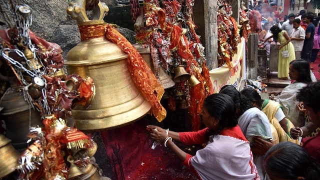 Women worshipping in a Hindu temple