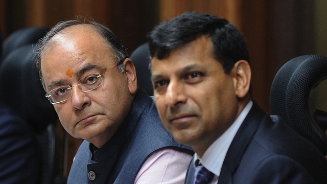 Indian finance minister Arun Jaitely (2L) along with Reserve Bank of India (RBI) governor Raghuram Rajan (3L) look on ahead of a meeting with the Central Board of Directors of the Reserve Bank of India in New Delhi on August 10, 2014. India's central bank governor Raghuram Rajan has defended his recent decision to keep the interest rates unchanged, reassuring  that the current policy will bring down the spiralling inflation. Rajan addressed a meeting of the central board of the Reserve Bank of India (RBI) in New Delhi, which met with the finance minister Arun Jaitley for the first time after he presented the maiden budget of his right-wing government in July.   AFP PHOTO/ SAJJAD HUSSAIN        (Photo credit should read SAJJAD HUSSAIN/AFP/Getty Images)