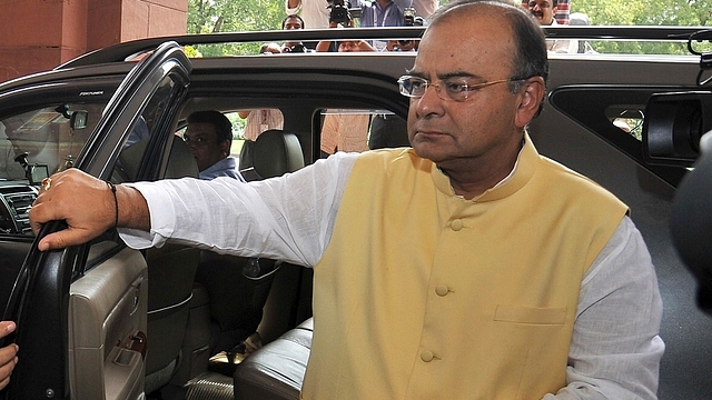 India's Finance Minister Arun Jaitley arrives at parliament to present his budget in New Delhi on July 10, 2014. India's new right-wing government under Prime Minister Narendra Modi unveiled its maiden budget on July 10, promising a new era of fiscal prudence and greater opportunities for foreign investors in key sectors of the economy.      AFP PHOTO / RAVEENDRAN        (Photo credit should read RAVEENDRAN/AFP/Getty Images)