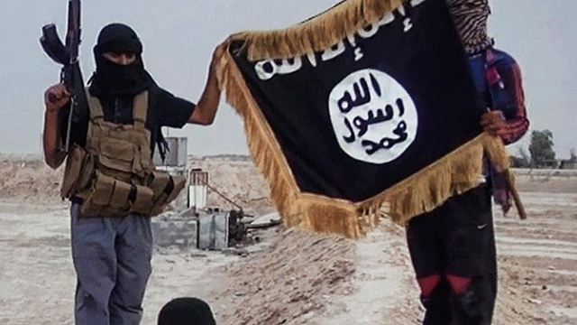 ISIS terrorists waving their flag.