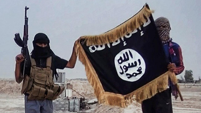 ISIS terrorists waving their flag.