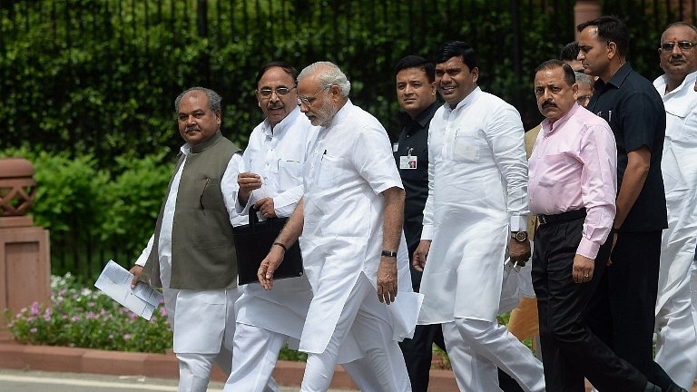 Prime Minister Modi walks along with other officials