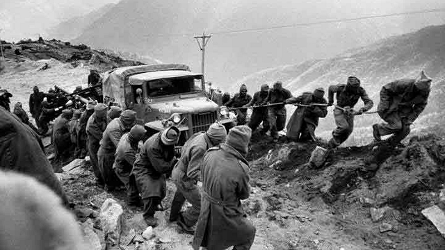 Indian Army soldier pull a jeep.