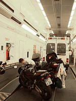Bikes and minibus inside a Eurotunnel shuttle wagon. (Wikimedia Commons/Bleiglass)