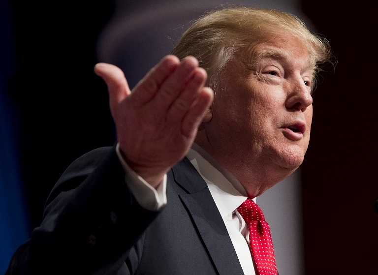 (FILES) In this December 3, 2015 file photo, Republican Presidential hopeful Donald Trump speaks during the 2016 Republican Jewish Coalition Presidential Candidates Forum in Washington, DC.   Donald Trump said December 10, 2015 he was postponing a planned trip to Israel, but vowed to return "after I become president of the US." The Republican firebrand, who is facing fierce criticism from around the world over his call for Muslims to be barred from entering the United States, had been set to meet with Israel Prime Minister Benjamin Netanyahu on December 28. AFP PHOTO / SAUL LOEB / AFP / SAUL LOEB