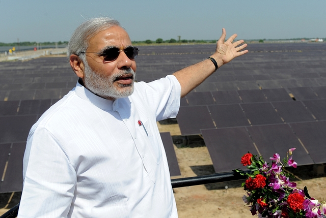 Modi at a solar power farm.