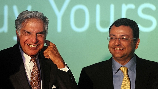 Ratan Tata interacts with Cyrus Mistry during an event in Mumbai. (PUNIT PARANJPE/AFP/GettyImages)