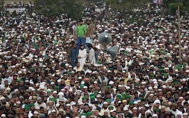 

Pakistani supporters of convicted murderer Mumtaz Qadri offers funeral prayers for Qadri a day after his execution in Rawalpindi on March 1, 2016. Tens of thousands of supporters of a Pakistani Islamist executed for gunning down a liberal governor gathered for his funeral March 1, sparking fears of violence, as schools closed and police cordoned off flashpoints. AFP PHOTO / Aamir QURESHI / AFP / AAMIR QURESHI (Photo credit: AAMIR QURESHI/AFP/Getty Images)