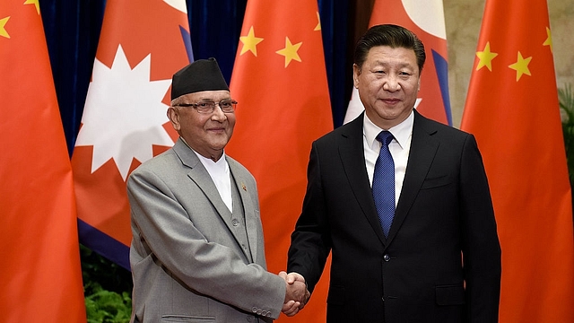 Nepal’s KP Sharma Oli with Xi Jinping (Etienne Oliveau/Getty Images)