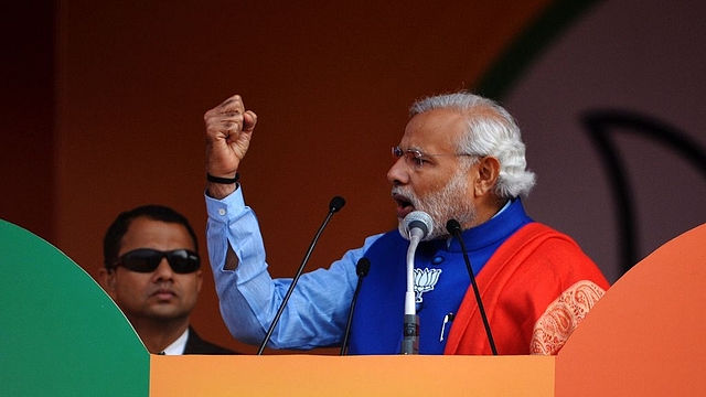 Narendra Modi during a rally: Photo credit: Chandan Khanna/AFP/GettyImages