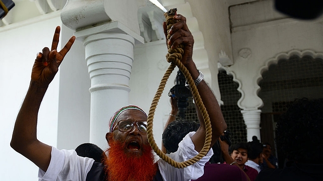 Bangladeshi activists celebrate the hanging of war criminals of the 1971 war. (STR/AFP/Getty Images)