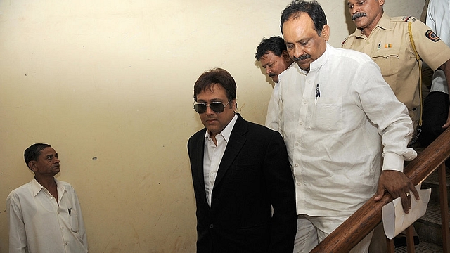 

Indian cinema actor and Congress party Member of Parliament Govinda (C) walks with others from The Collector’s Office in Mumbai on March 20, 2009. Actor-politician Govinda, who represents the Mumbai North Lok Sabha seat, had been issued notice by the District Election Officer seeking explanation over his alleged distribution of currency notes to some people outside his residence on Holi. On March 12, the election authorities inquired into the incident in which the actor allegedly distributed currency notes to fans outside his house here during Holi celebrations. AFP PHOTO/ Pal PILLAI (Photo credit should read PAL PILLAI/AFP/Getty Images)