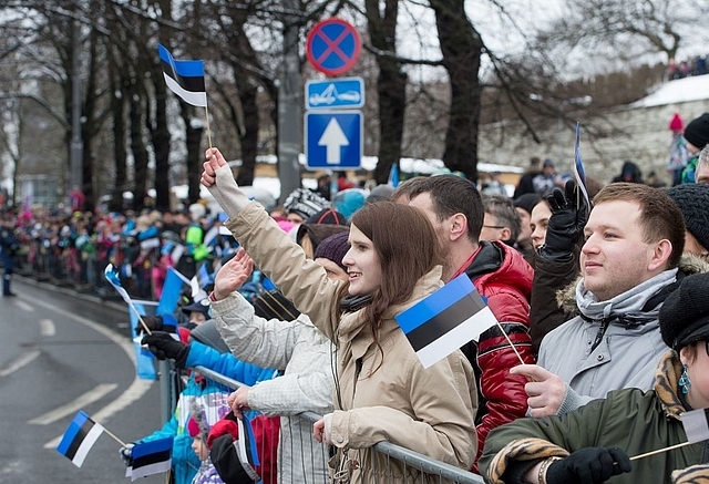 
Estonians wave flags as they observe a parade during independence 
day celebrations.        (Photo credit 
should read RAIGO PAJULA/AFP/Getty Images)



