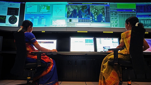 

Scientists from the Indian Space Research Organisation (ISRO) work in the Indian Regional Navigational Satellite System (IRNSS) control room at the Indian Deep Space Network (IDSN), a network of large antennas and communication facilities that support India’s interplanetary spacecraft missions, located at Byalalu village about 50 kms from Bangalore city on May 28, 2013. The ISRO inaugurated the Satellite Navigation Centre for Indian Regional Navigational Satellite System at the IDSN facility today. AFP PHOTO/ Manjunath KIRAN (Photo credit: Manjunath Kiran/AFP/Getty Images)