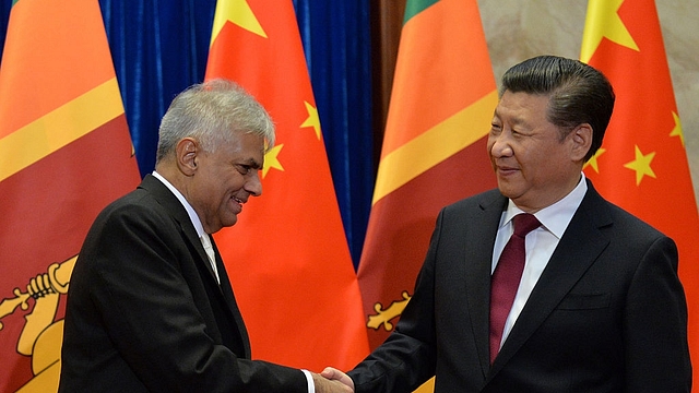 Sri Lankan Prime Minister, Ranil Wickremesinghe (L) and Chinese President, Xi Jinping (KENZABURO FUKUHARA (Photo credit should read KENZABURO FUKUHARA/AFP/Getty Images)