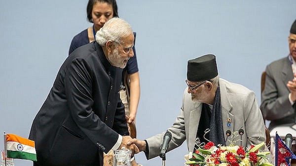 Narendra Modi greets Sushil Koirala, Prime Minister of Nepal (Photo: Pool/Getty Images)