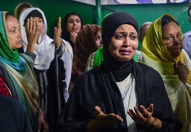 Relatives
and friends of the victims of the bloody attack mourn their death during their
funeral in Dhaka. (Photo credit: AFP/Getty Images)<b></b>