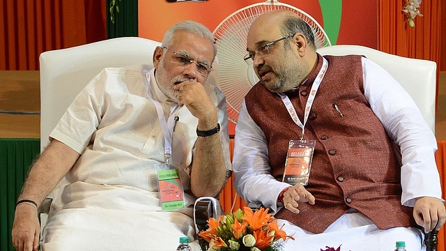 Prime Minister Narendra Modi with BJP president Amit Shah. (Photo credit:  RAVEENDRAN/AFP/Getty Images))