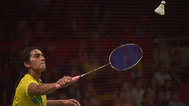 

P.V. Sindhu (L) of India hits a return against Li Xuerui of China during their round of 16 women’s singles match of the 2015 World Championships badminton tournament in Jakarta on August 13, 2015. AFP PHOTO / ADEK BERRY (Photo credit should read ADEK BERRY/AFP/Getty Images)