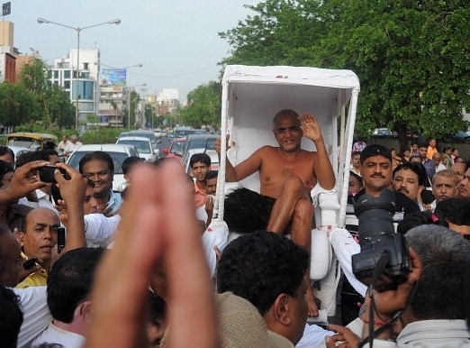 Muni Shri Tarun Sagar Ji Maharaj, the  Digambar Saint, is carried naked as he blesses the devotees in Ahmedabad (SAM PANTHAKY/AFP/GettyImages)