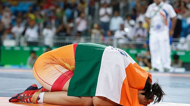 

India’s Sakshi Malik celebrates after winning against Kirghyzstan’s Aisuluu Tynybekova in their women’s 58 kg freestyle bronze medal match on August 17, 2016, during the wrestling event of the Rio 2016 Olympic Games at the Carioca Arena 2 in Rio de Janeiro. / AFP / Jack GUEZ (Photo credit should read JACK GUEZ/AFP/Getty Images) 