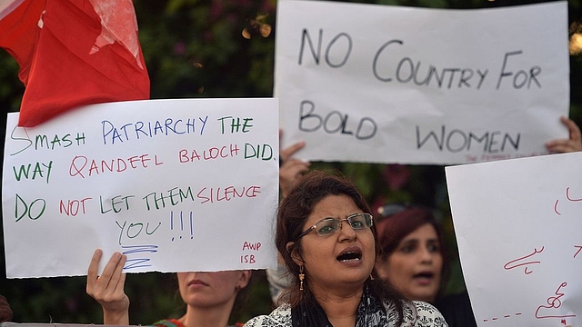 Pakistani civil society activists carry placards during a protest in
Islamabad against the murder of Baloch. Photo credit: AAMIR QURESHI/AFP/GettyImages