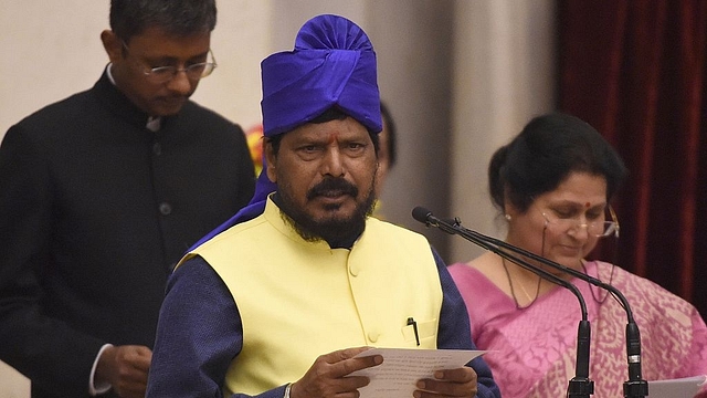 

Indian member of Parliament Ramdas Athawale takes the oath during the swearing-in ceremony of new ministers following Prime Minister Narendra Modi’s cabinet re-shuffle, at the Presidential Palace in New Delhi on July 5, 2016. Indian Prime Minister Narendra Modi revamped his cabinet on July 5 bringing in 19 new junior ministers to speed up decision-making and delivery on promises made in this year’s budget. / AFP / Prakash SINGH (Photo credit should read PRAKASH SINGH/AFP/Getty Images)