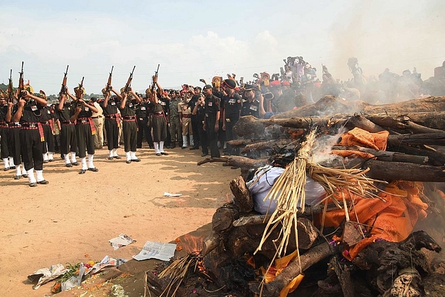 
Indian army personnel salute during the funeral of army soldier Sunil Kumar Vidyarth. (Photo By: 


STR/AFP/Getty Images)