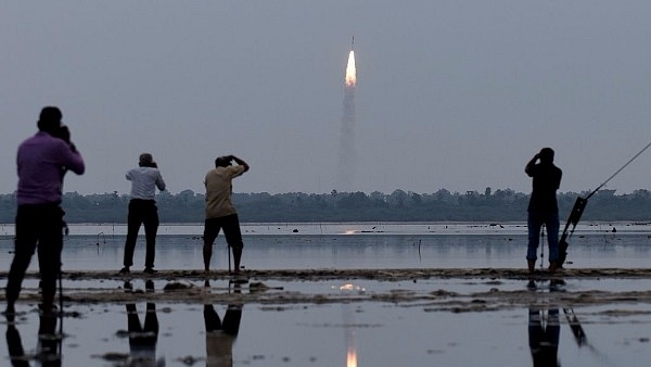 Indian residents photograph the launch of the ISRO PSLV-C35 (ARUN SANKAR/AFP/Getty Images)