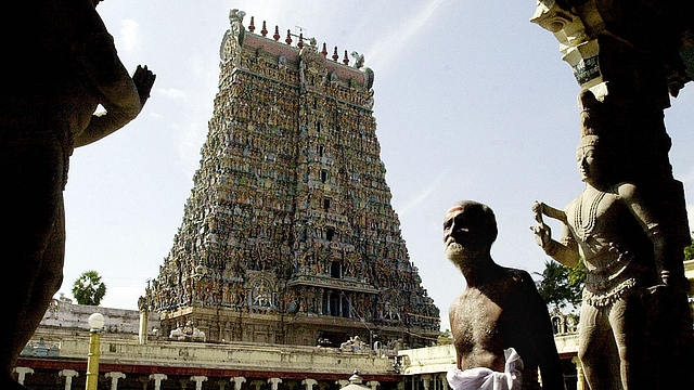 A devotee walks past the entrance to the Meenakshi temple in
Madurai (DIBYANGSHU SARKAR/AFP/GettyImages)