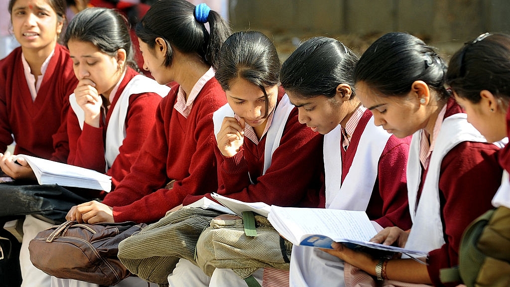 Indian schoolchildrenprepare for their CBSE senior school certificate examinations before enteringan examination hall in New Delhi (RAVEENDRAN/AFP/GettyImages)