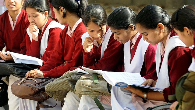 Indian schoolchildrenprepare for their CBSE senior school certificate examinations before enteringan examination hall in New Delhi. (RAVEENDRAN/AFP/GettyImages)