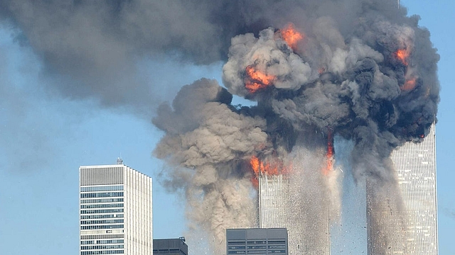 The World Trade Center buildings on fire after being hit by
two planes on 11 September 2001, in New York. Photo: Spencer Platt/GettyImages. &nbsp; &nbsp; &nbsp;