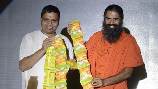 

Acharya Balkrishna and Baba Ramdev at the launch of a product.