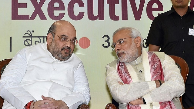 Amit Shah (L) and PM Narendra Modi (MANJUNATH KIRAN/AFP/Getty Images)