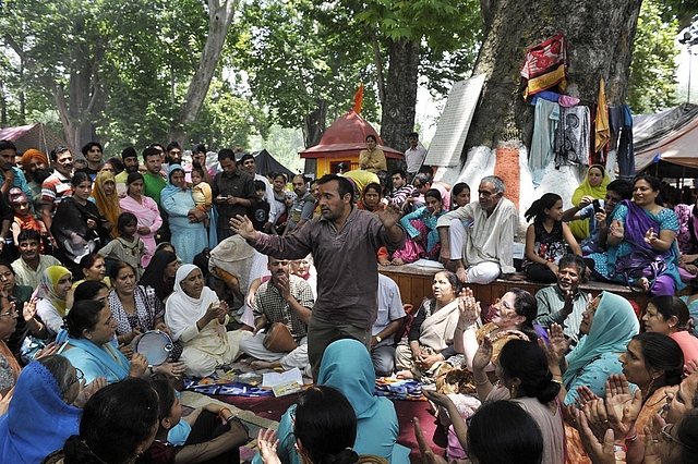 
A Indian Kashmiri Hindu (Pandit) devotee dances during the annual Hindu festival (Picture By:


TAUSEEF MUSTAFA/AFP/Getty Images)

