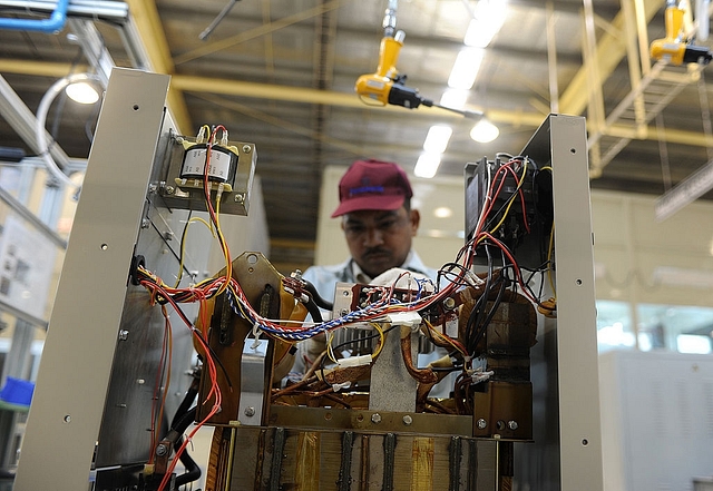 
An Indian employee works at the Panasonic ‘eco ideas’ factory at 
Jhajjar in Haryana.(Photo credit: SAJJAD HUSSAIN/AFP/Getty Images)

