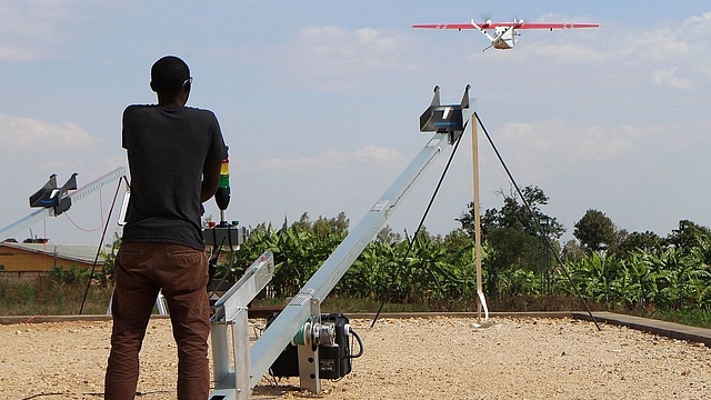 A technician of California-based robotics company Zipline launches a drone. (STEPHANIE AGLIETTI/AFP/Getty Images)