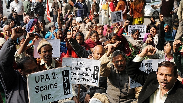 Demonstrators stage a rally against UPA-2 scams in New Delhi.
Photo credit: RAVEENDRAN/AFP/GettyImages &nbsp;    