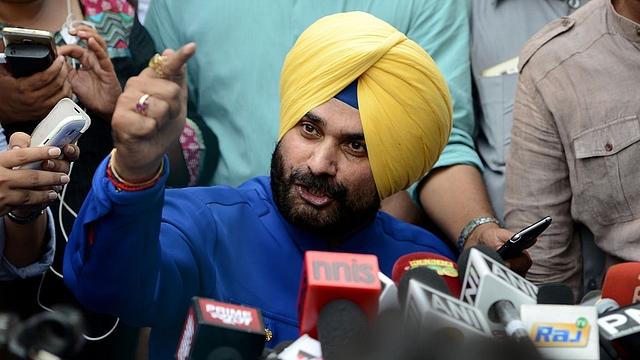 Sidhu addresses the media. (MONEY SHARMA/AFP/GettyImages)