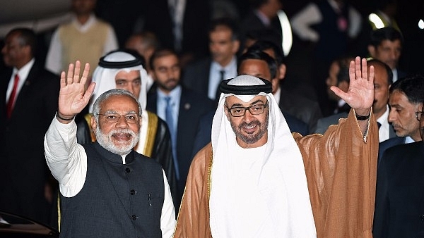 Prime Minister Narendra Modi (L) and Crown Prince of Abu Dhabi Sheikh Mohammed Bin Zayed Al Nahyan (R) wave to the crowd (PRAKASH SINGH/AFP/Getty Images)