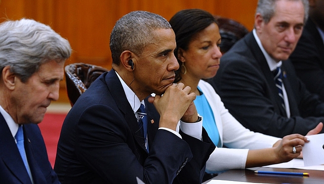 US President Barack Obama (2nd L), flanked by US Secretary of State John Kerry (L), National Security Advisor Susan Rice (2nd R) and US Trade Representative Michael Froman (R) (HOANG DINH NAM/AFP/Getty Images)