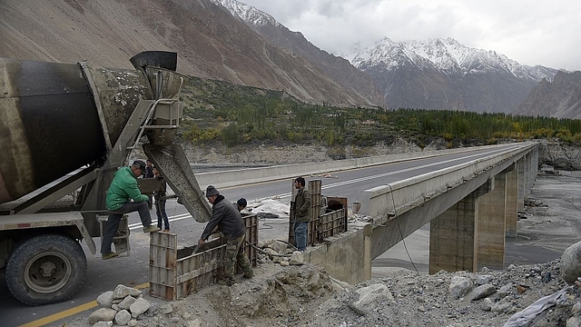 Chinese labourers work on the Karakoram Highway in Gulmit village of Hunza valley in northern Pakistan. (AAMIR QURESHI/AFP/Getty Images)