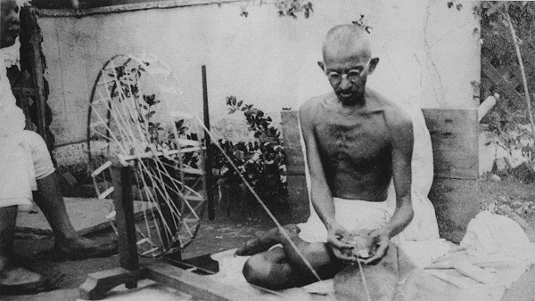 Mahatma Gandhi spinning yarn, in the late 1920s (Wikimedia Commons)