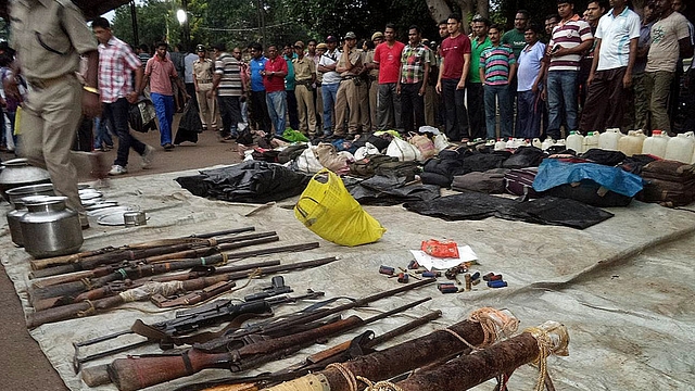 Arms seized from
Maoists are displayed at the Malkangiri district police headquarters. Photo credit: STR/AFP/GettyImages<b></b>