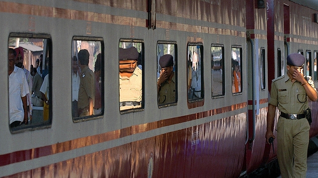 A policemen walks past the Rajdhani
Express prior to it’s departure from a station in Kolkata. Photo credit: DESHAKALYAN CHOWDHURY/AFP/GettyImages