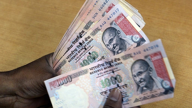 Old Indian Rs 1,000 currency notes (INDRANIL MUKHERJEE/AFP/GettyImages)