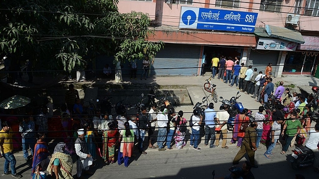 Customers line up next to an ATM at a bank in Siliguri: (Photo credit: DIPTENDU DUTTA/AFP/GettyImages)