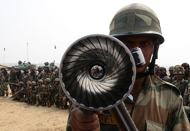 
An Indian Army soldier poses with a bazooka during the INDRA 2013 
Indo-Russia joint military drill.       (Photo Credit: SAM PANTHAKY/AFP/Getty Images)

